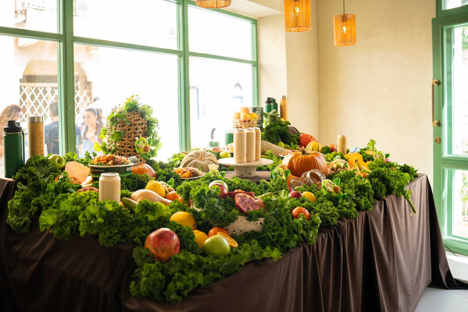 eeetwell restaurant with a long table of autumn produce