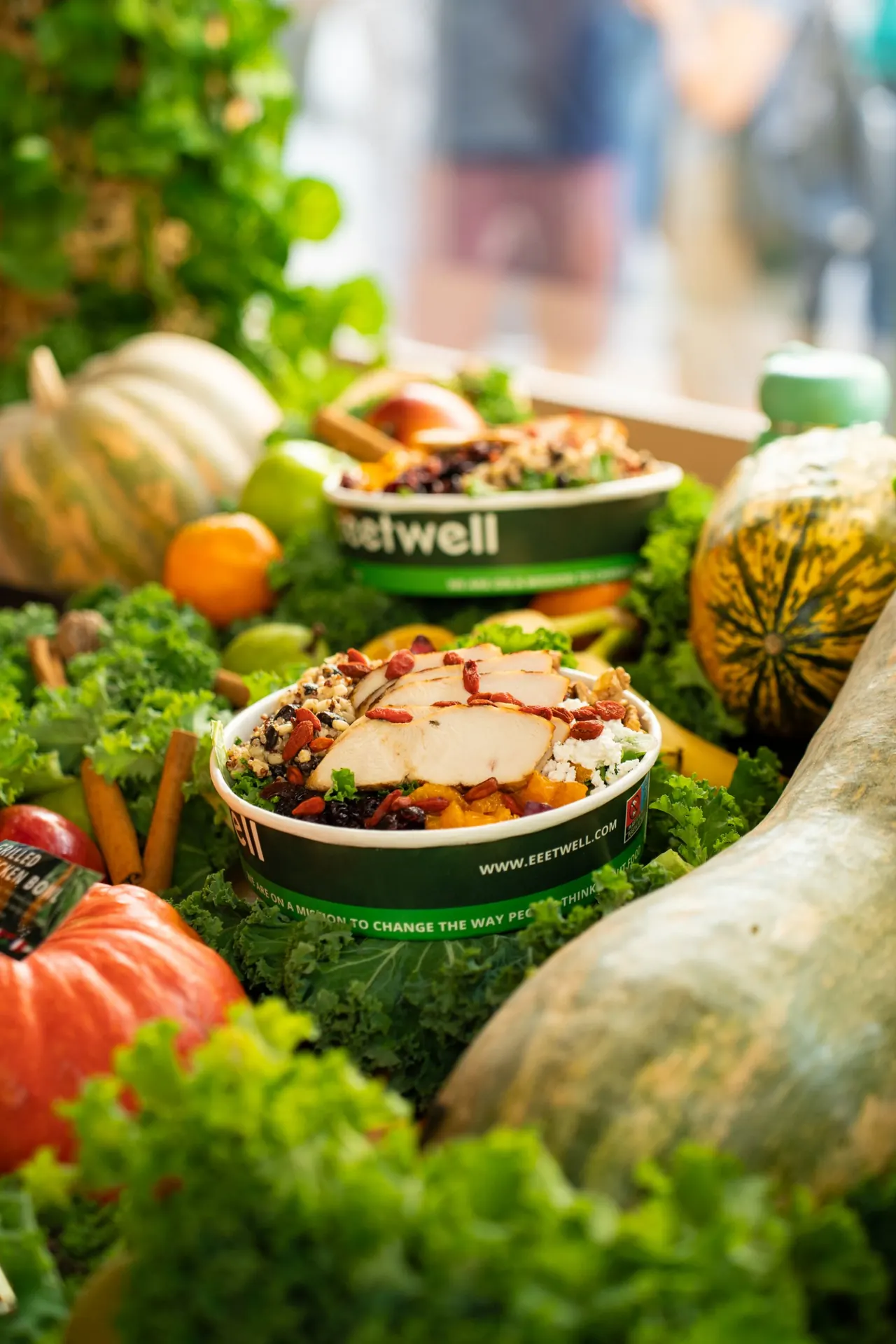 eeetwell grilled chicken bowl among pumpkins and kale
