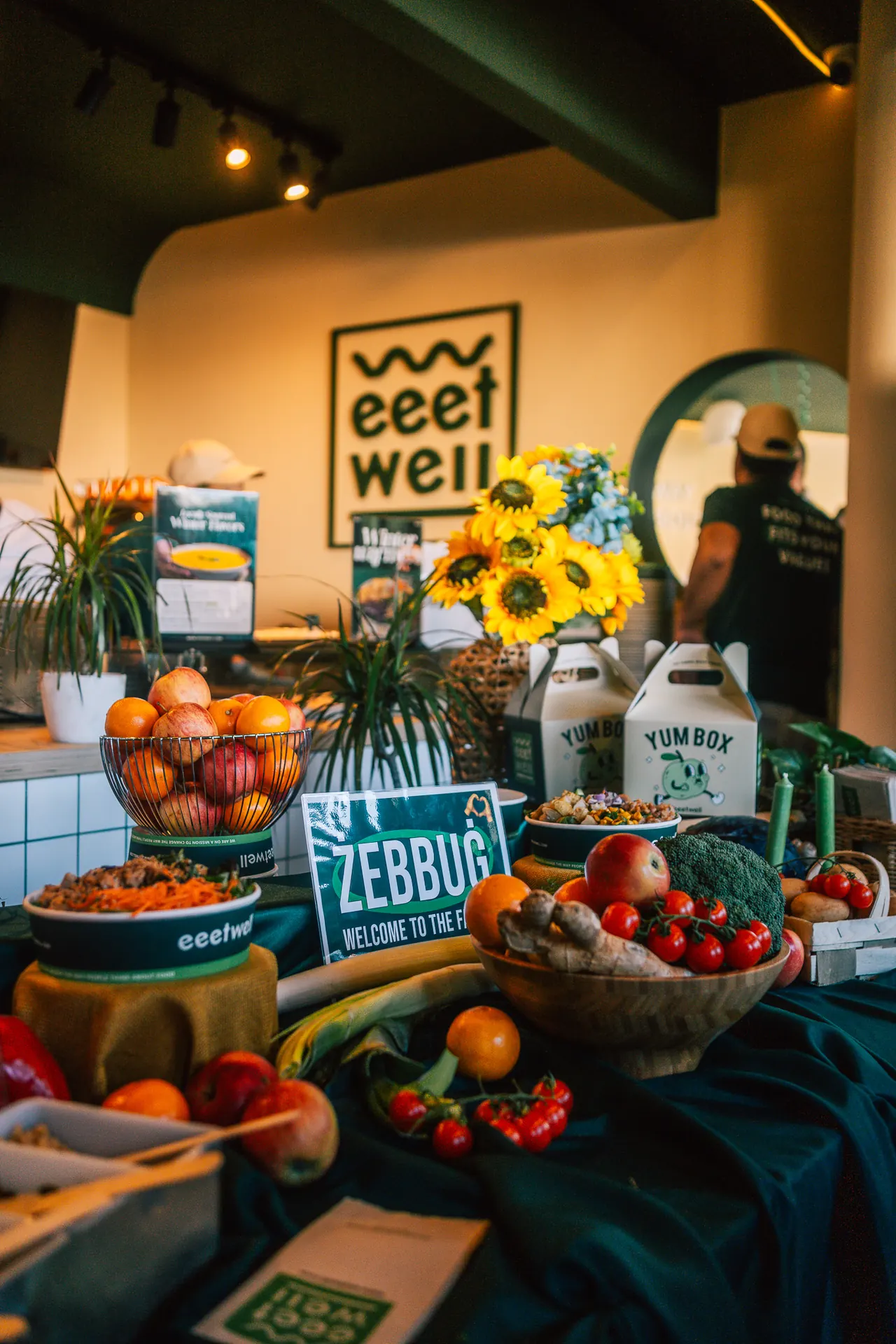Launch table at eeetwell Żebbuġ with fruit and sunflowers