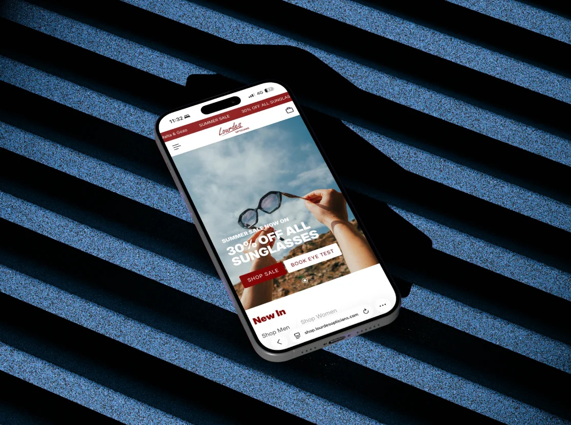 Lourdes Opticians website on a phone
